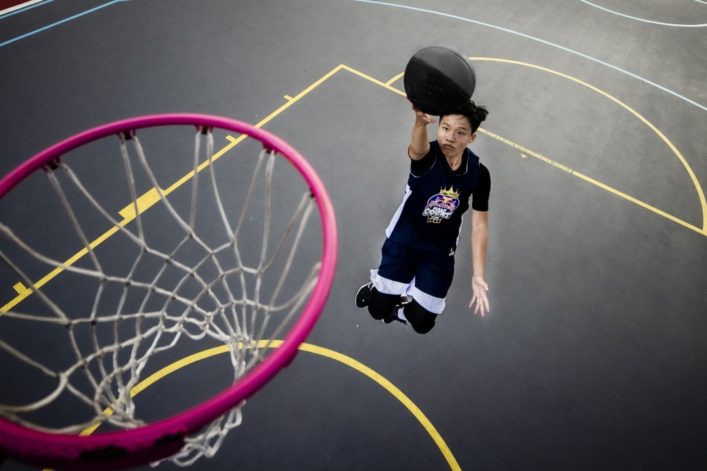 Hong Kong basketball player Li Tsz-kwan aims for the basket during a photo shoot to celebrate her Red Bull sponsorship. Photos: Red Bull