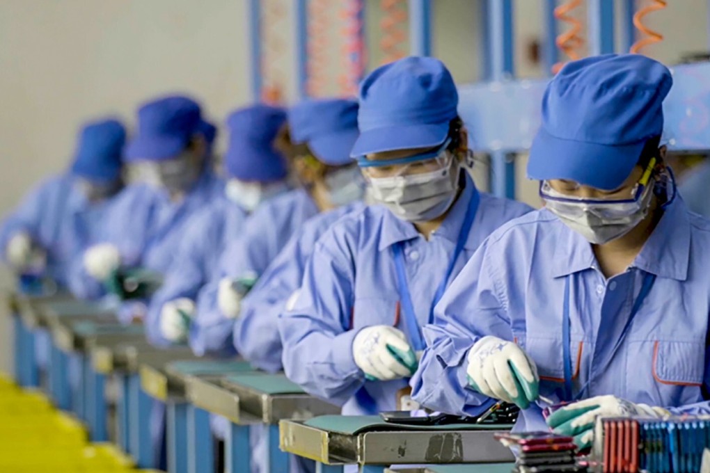 Smartphones are disassembled into separate parts, including the case, screen, battery and circuit board, for further recycling. Photo: Handout