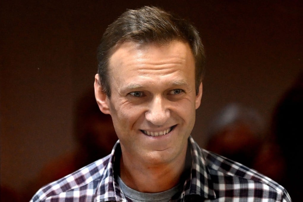 Russian opposition leader Alexei Navalny stands inside a glass cell during a court hearing in Moscow in February. Photo: AFP