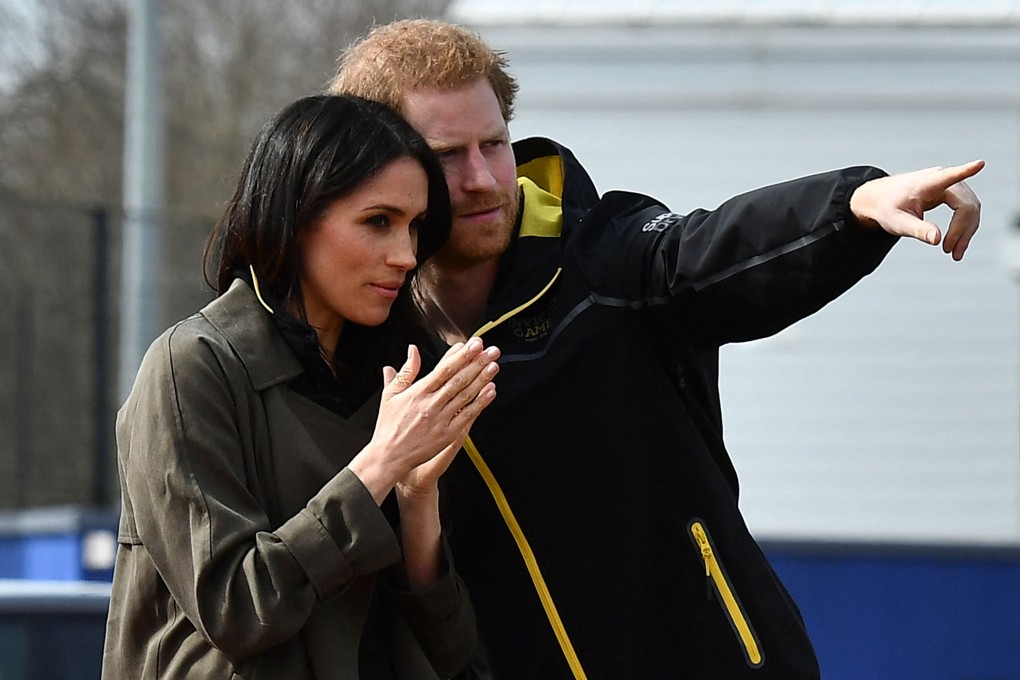Britain’s Prince Harry gestures to Meghan Markle during British team trials for the Invictus Games Sydney 2018 in Bath, southwest England. Photo: AFP