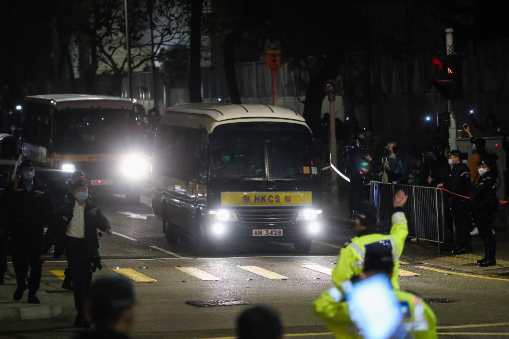 The 47 opposition figures facing national security law charges leave West Kowloon Court after their bail hearings were adjourned on Wednesday. Photo: Edmond So