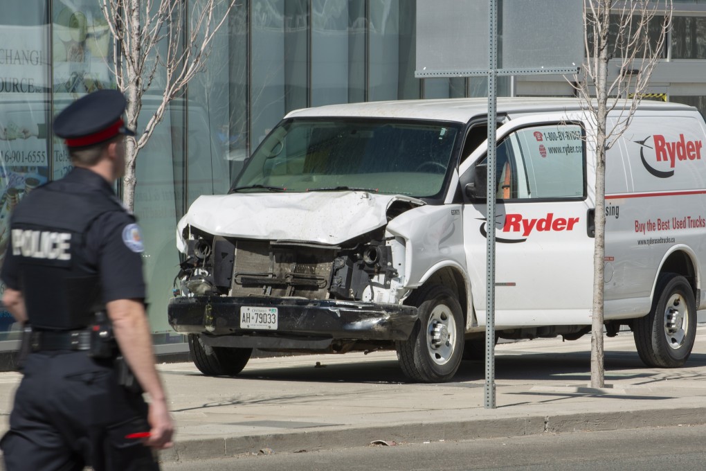A rented van sits on a pavement about 1.6km from a deadly attack in Toronto in April 2018. Photo: EPA-EFE