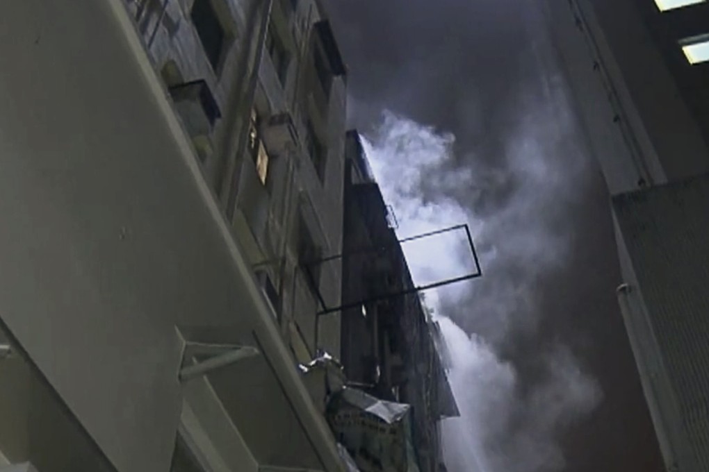 Man makes death-defying leap from eighth-floor Hong Kong flat to an ...