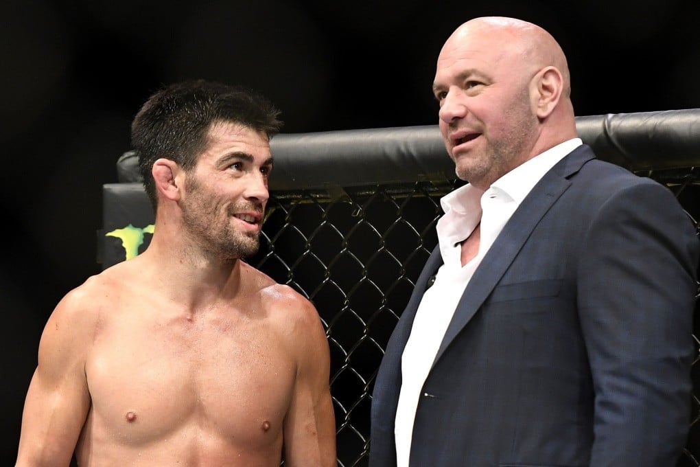 Dominick Cruz with UFC president Dana White after being defeated by Henry Cejudo in their bantamweight title fight during UFC 249. Photo: AFP