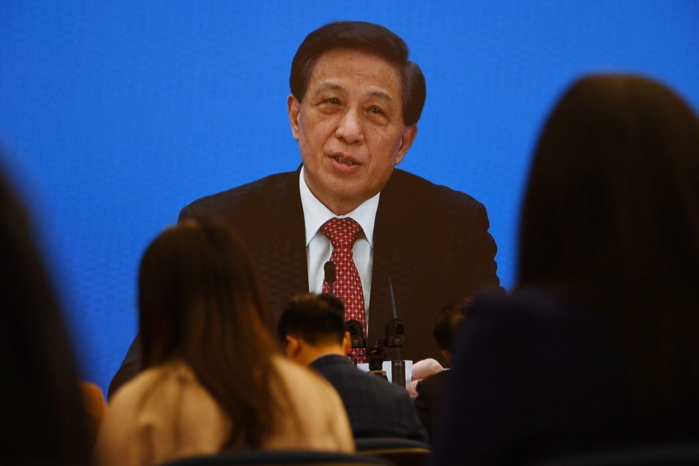 NPC spokesman Zhang Yesui speaks via video link on Thursday ahead of the opening session of the National People’s Congress in Beijing. Photo: AFP