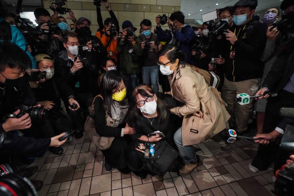 The foster mother of Hendrick Lui, one of the 15 granted bail but remanded in custody, breaks down outside court. Photo: Felix Wong