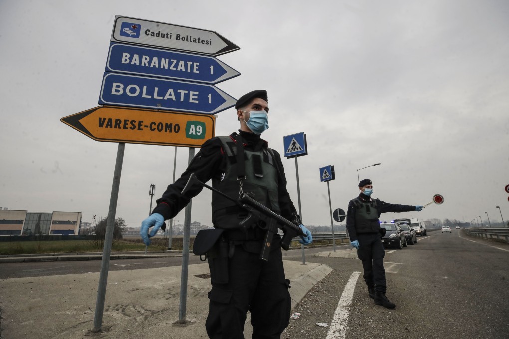 Carabinieri officers patrol one of the main access roads to Bollate, on the outskirts of Milan, Italy. Europe recorded 1 million new Covid-19 cases last week, an increase of 9 per cent from the previous week and ending a six-week decline. Photo: AP