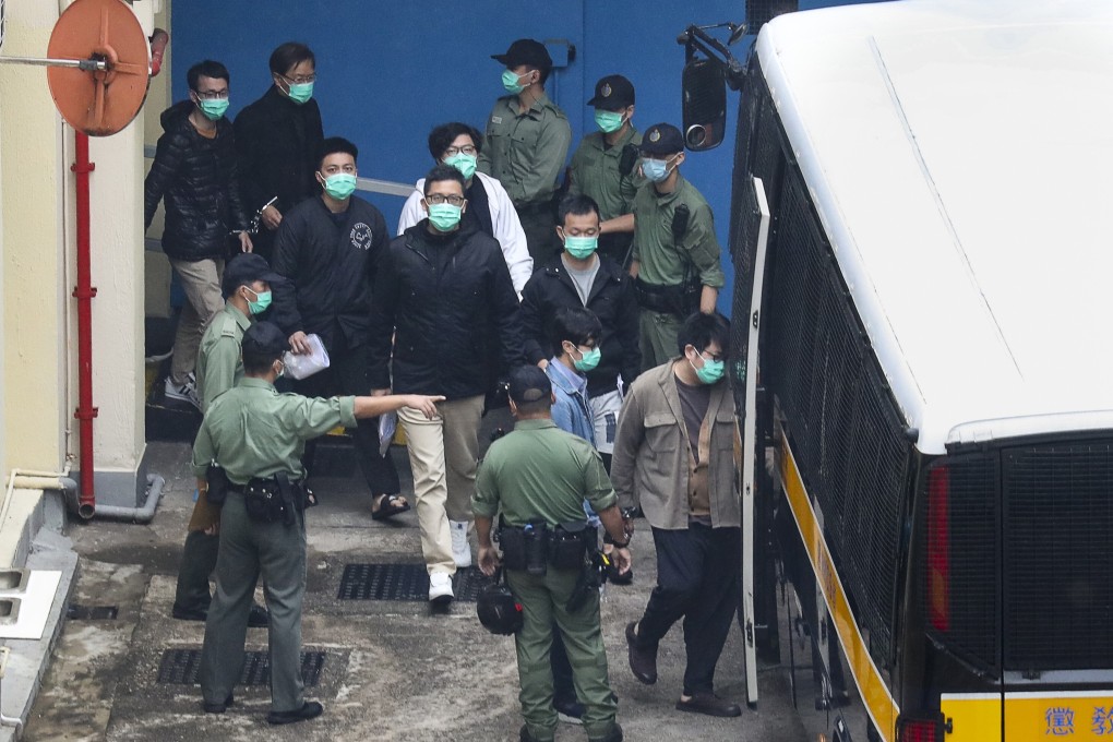 Former opposition lawmakers and activists left Lai Chi Kok Reception Centre in Hong Kong for the fourth day of their court hearing last Thursday, facing charges of conspiracy to commit subversion. Photo: Dickson Lee