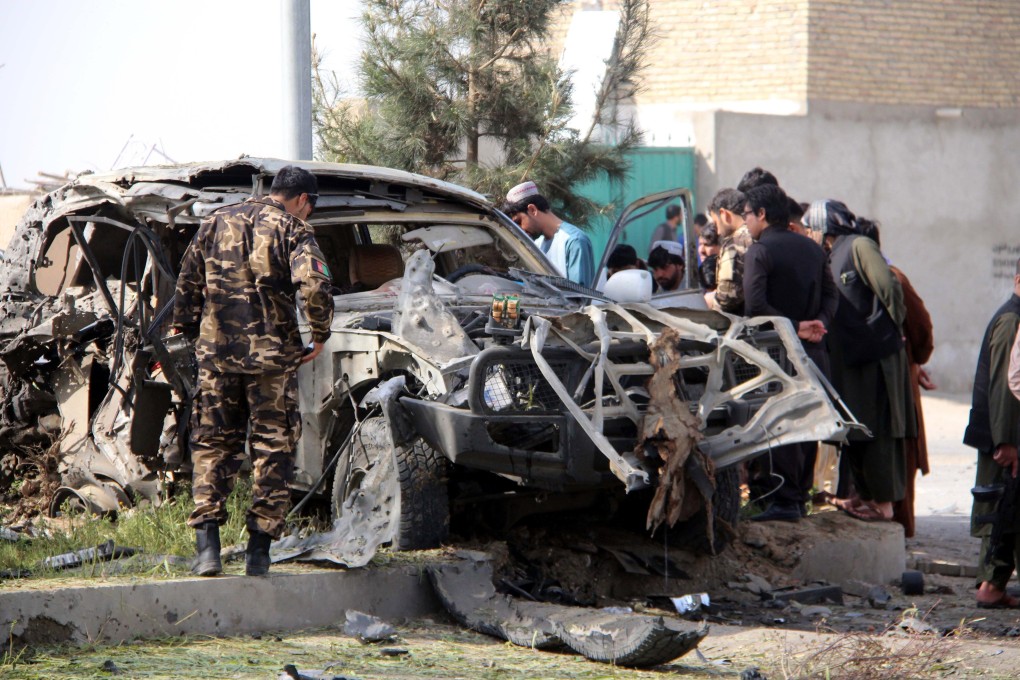 Afghan security officials inspect the scene of a bomb blast that targeted Sayed Mahmood Agha, chief of the National Directorate of Security (NDS) in Lashkar Gah, Helmand province, Afghanistan on Saturday. Photo: EPA-EFE
