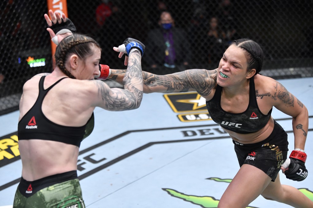 Amanda Nunes punches Megan Anderson in their UFC featherweight championship fight during UFC 259. Photo: Jeff Bottari/Zuffa LLC