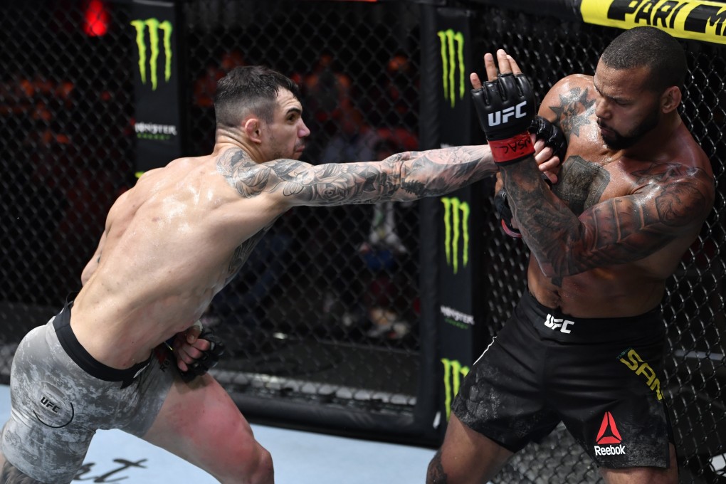 Aleksandar Rakic punches Thiago Santos in their light heavyweight fight during UFC 259. Photos: Jeff Bottari/Zuffa LLC