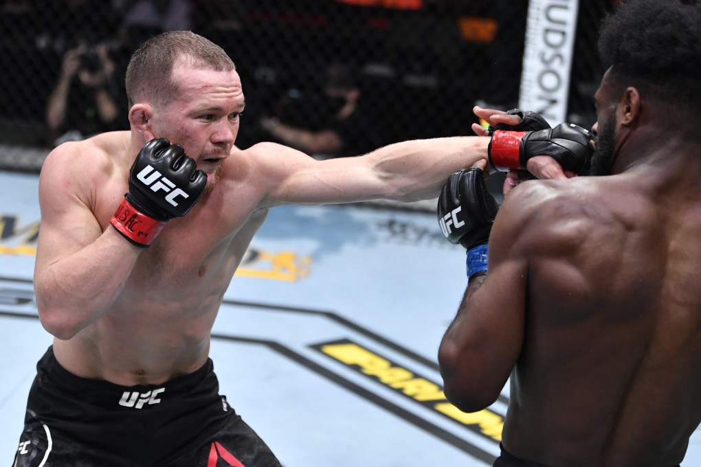 Petr Yan punches Aljamain Sterling in their bantamweight championship fight during UFC 259. Photo: Jeff Bottari/Zuffa LLC