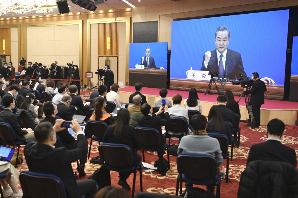 Reporters attend an online press conference by Chinese Foreign Minister Wang Yi on Sunday in Beijing. Photo: Kyodo