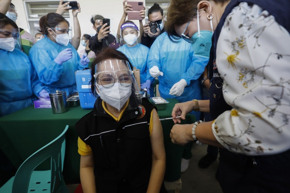 A Philippine doctor receives a shot of the AstraZeneca Covid-19 vaccine. Photo: EPA