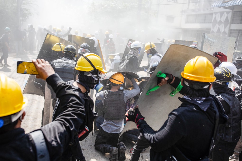 Protesters clash with security forces in Yangon on Monday during a demonstration against the military coup and the detention of civilian leaders in Myanmar. Photo: DPA