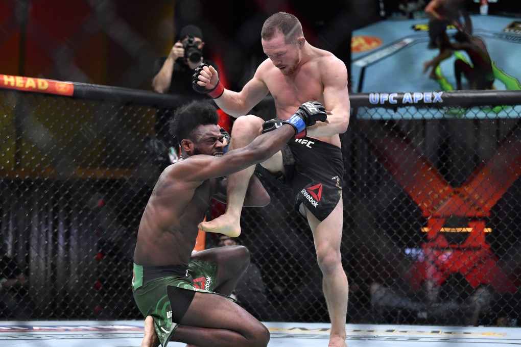 Petr Yan knees Aljamain Sterling in the head with an illegal strike while he is grounded at UFC 259. Photo: Photo: Chris Unger/Zuffa LLC