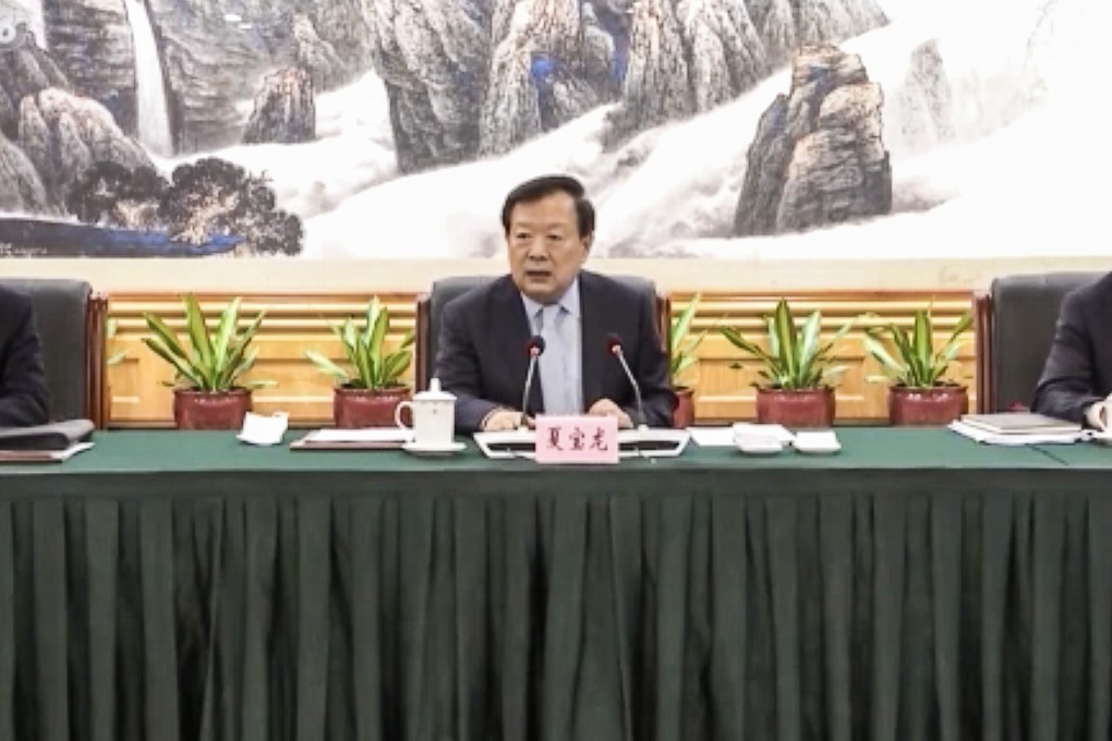 Xia Baolong (centre), director of the State Council’s Hong Kong and Macau Affairs Office, attends a seminar with pro-establishment figures in Shenzhen on Monday. Photo: CCTV