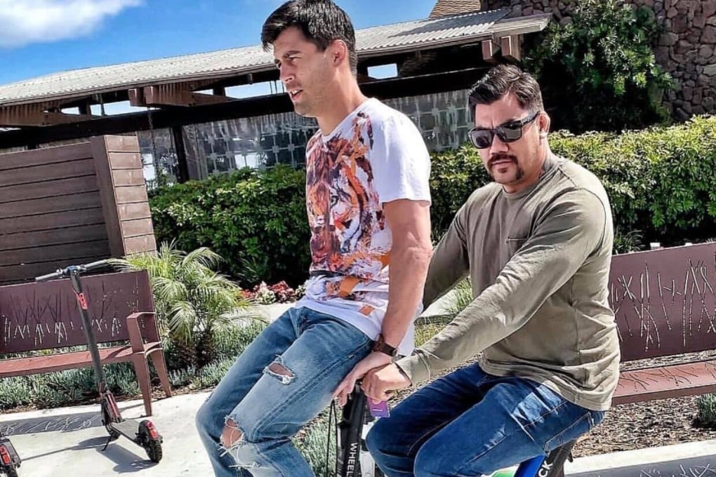 Dominick Cruz rides on the handlebars of Hans Molenkamp’s bike. Photo: Facebook/Dominick Cruz