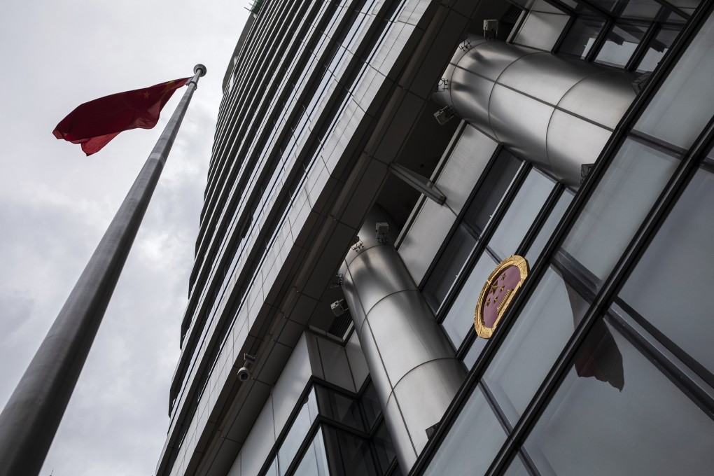 The Chinese flag and emblem are displayed outside the Office for Safeguarding National Security in Hong Kong. Photo: Bloomberg