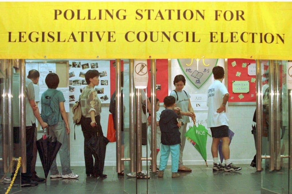 Hong Kong voters queue up at a polling station to wait for their turn to cast ballots in the first legislative elections in 1998. Photo: Reuters