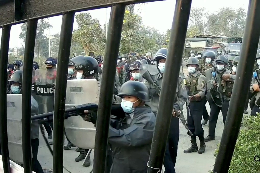 Police officers march towards a university in Myanmar, where demonstrators were protesting against the military coup. Photo: Reuters