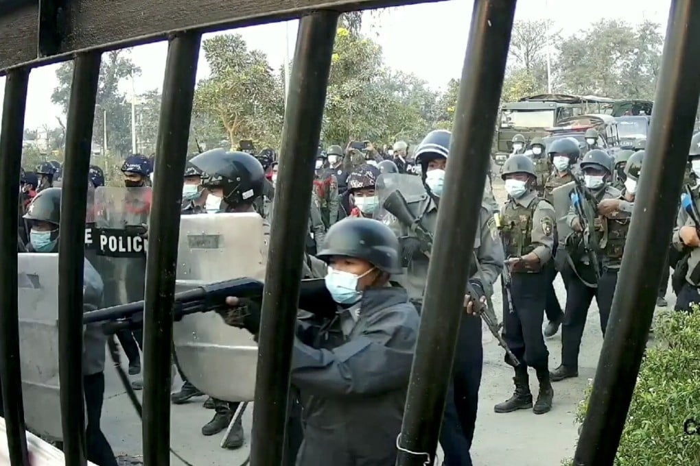 Police officers march towards a university in Myanmar, where demonstrators were protesting against the military coup. Photo: Reuters