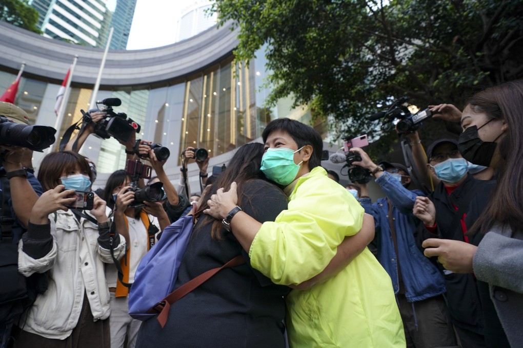 Former lawmaker Helena Wong hugs a supporter outside the High Court after being released on bail on Thursday. Photo: Felix Wong