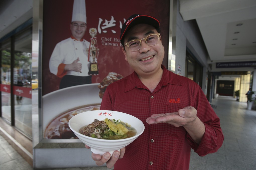 Chef Hung Ching Lung shows off his new pineapple beef noodle dish. Photo: AP