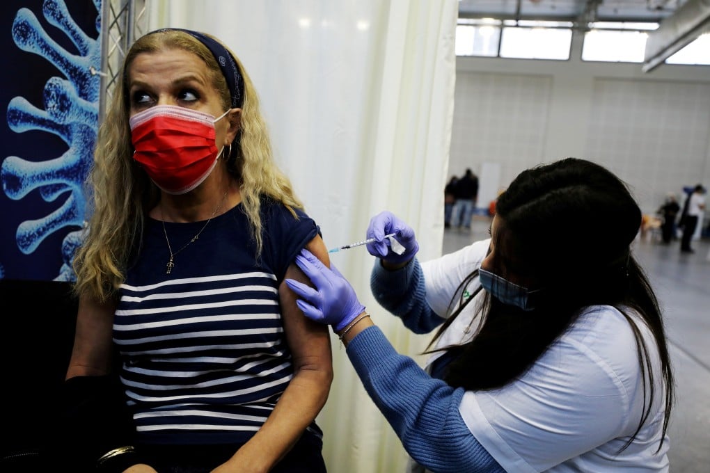A woman receives a Covid-19 vaccine in Petah Tikva, Israel. File photo: Reuters