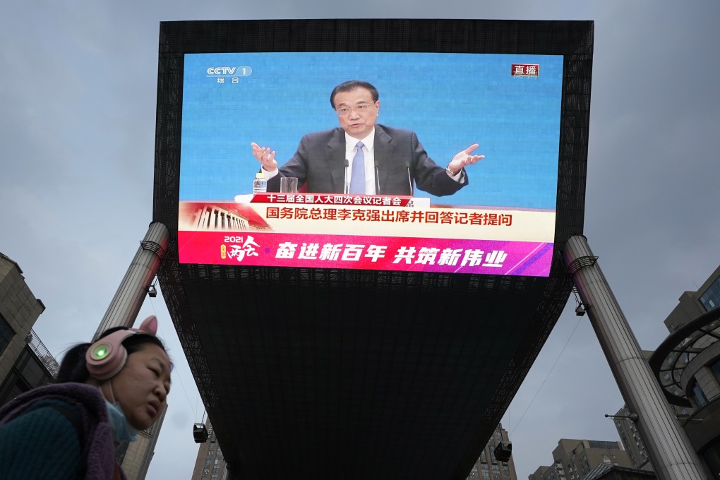 Premier Li Keqiang is seen on a screen in Beijing giving a press conference at the end of the National People’s Congress on Thursday. Photo: AP