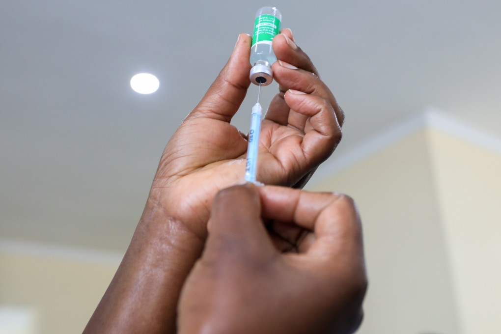 A Kenyan health care worker prepares to administer a dose of the Oxford/AstraZeneca Covid-19 vaccine. Many poorer countries are far behind Western nations in their roll-out programmes, being unable to purchase vaccines at the same scale and price. Photo: EPA-EFE