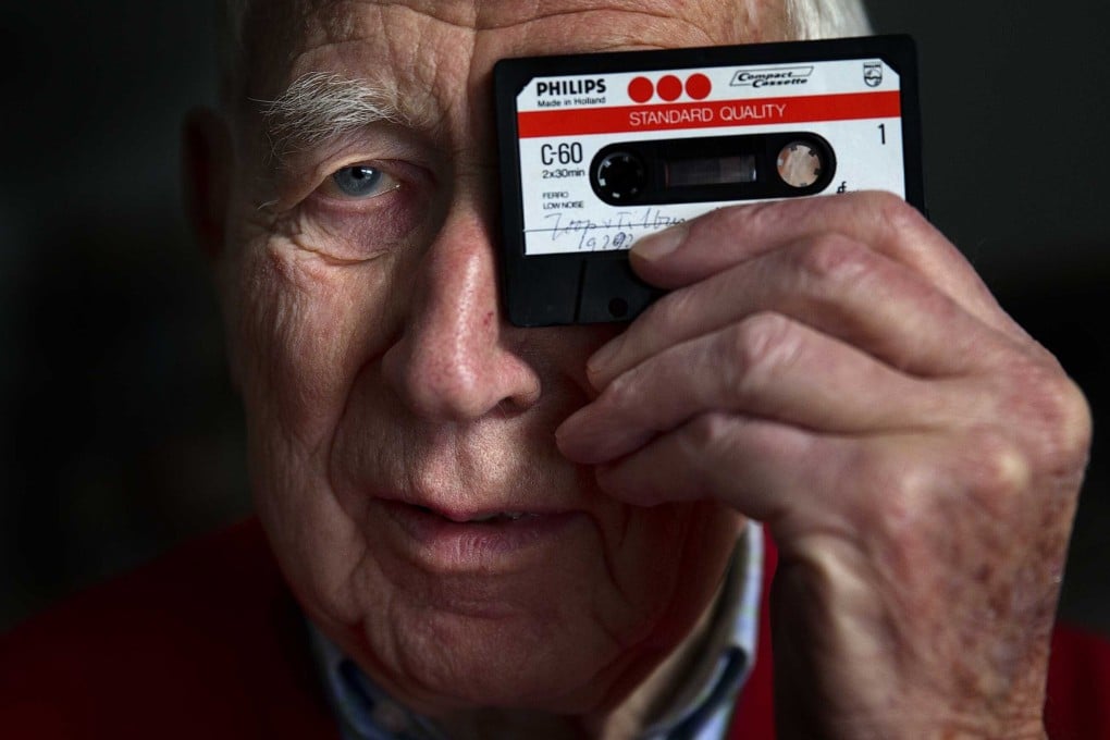 Dutch engineer Lou Ottens poses with a cassette tape in Eindhoven, the Netherlands in January 2013. Photo: EPA-EFE