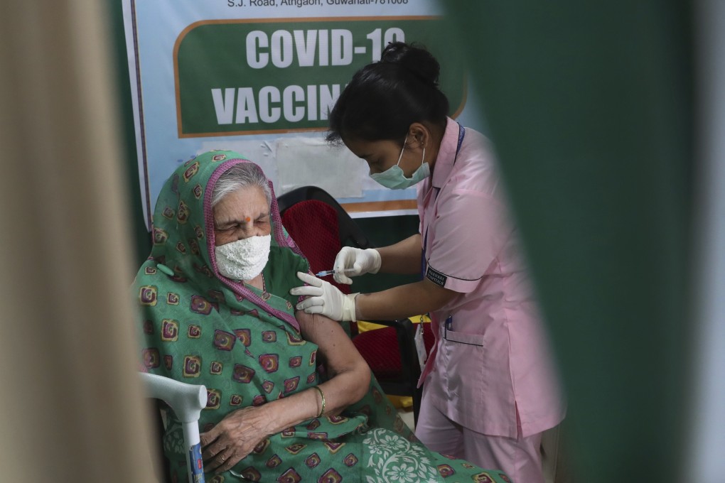A woman receives a Covid-19 vaccine shot in Gauhati, India. Photo: AP