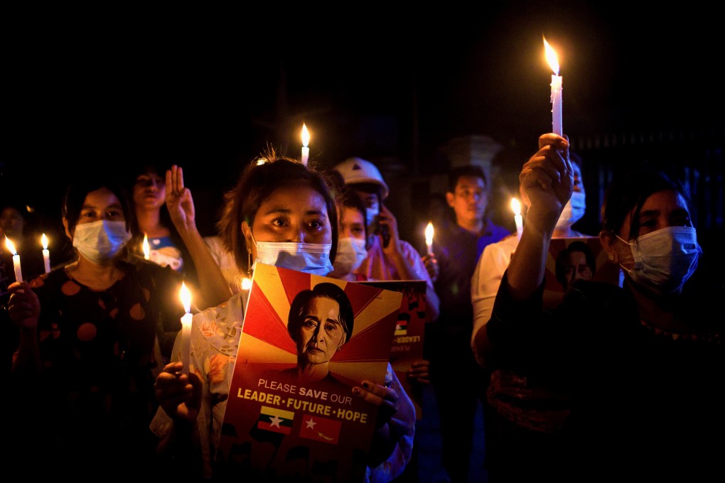 People hold candles during a nationwide night protest against the military coup in Mandalay, Myanmar on Friday. Photo: Reuters