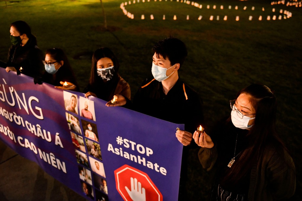 A vigil in California remembers those who have died from Covid-19 while countering ‘Asian hate’. Photo: AFP