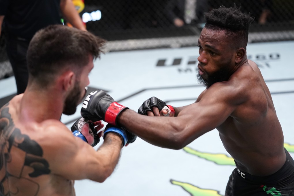 Manel Kape punches Matheus Nicolau in their flyweight bout during the UFC Fight Night event at the UFC APEX on March 13, 2021 in Las Vegas, Nevada. Photos: Jeff Bottari/Zuffa LLC via Getty Images