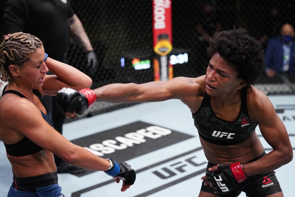 Angela Hill punches Ashley Yoder in a strawweight fight during the UFC Fight Night event at the UFC Apex on March 13, 2021 in Las Vegas, Nevada. Photo: Jeff Bottari/Zuffa LLC via Getty Images