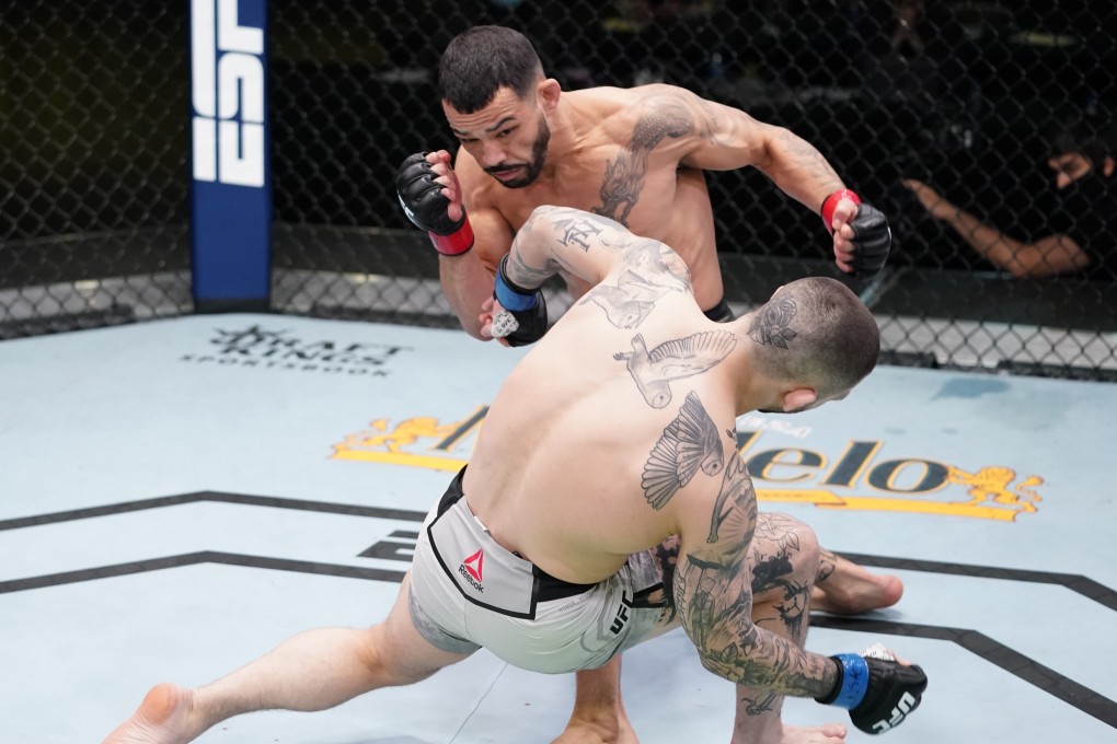 Dan Ige knocks out Gavin Tucker in a featherweight fight during the UFC Fight Night event at UFC Apex on March 13, 2021 in Las Vegas, Nevada. Photos: Jeff Bottari/Zuffa LLC via Getty Images
