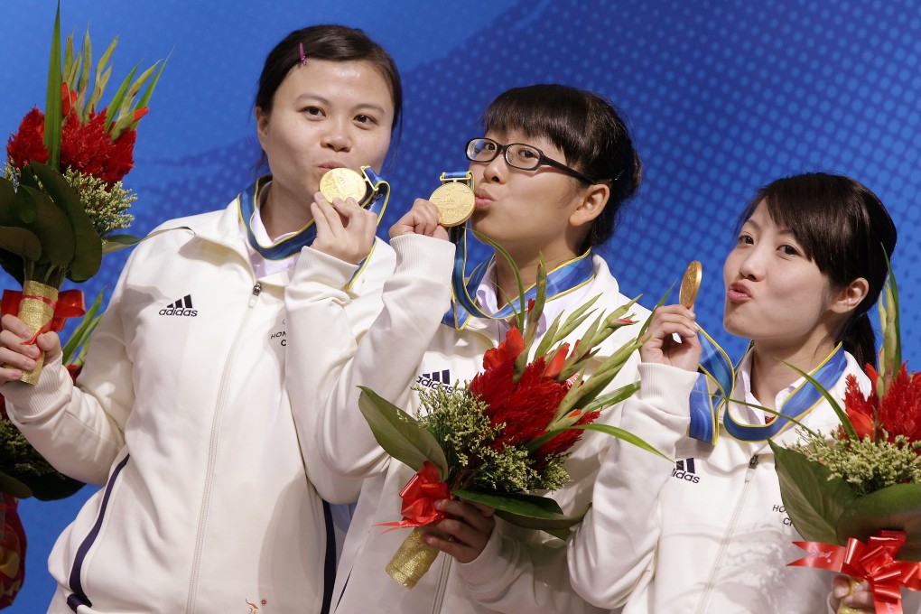 (Left to right): So Man-yan, Ng On-yee and Jaique Ip Wan-in celebrate their gold medal at the 2010 Asian Games 6-red event in Guangzhou. Photo: SCMP