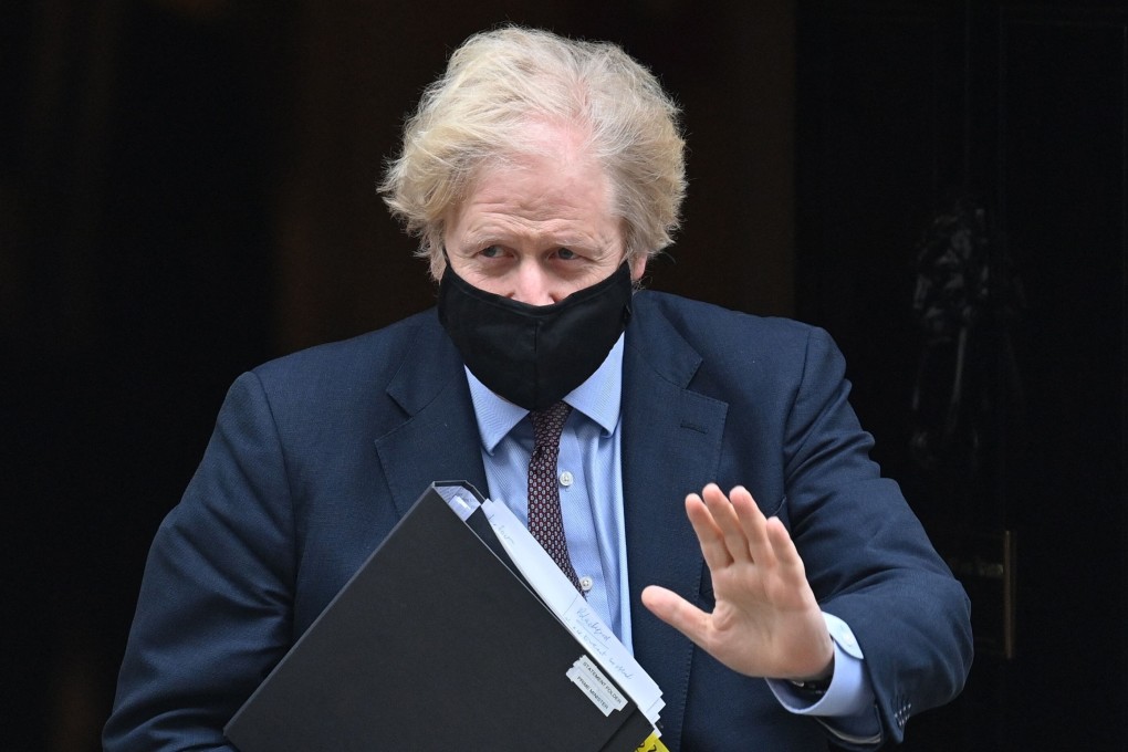 Britain’s Prime Minister Boris Johnson leaves 10 Downing street to deliver a statement to Parliament on the government’s Integrated Review. Photo: AFP