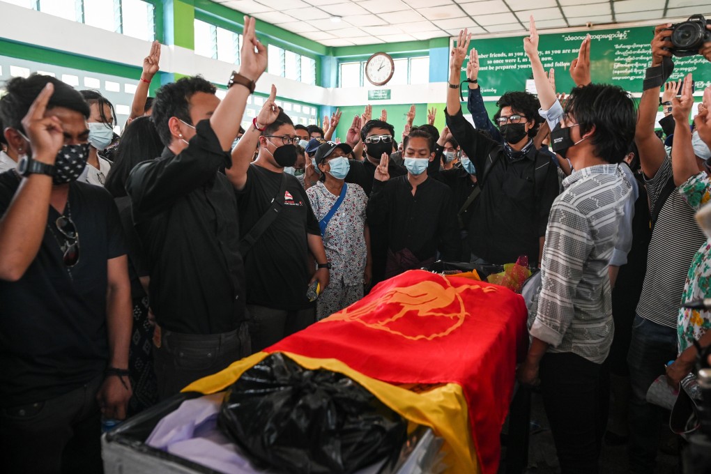 Mourners display a three-fingered salute while attending the funeral of Khant Nyar Hein, a 19-year-old medical student who was shot and killed in Yangon. Photo: Reuters