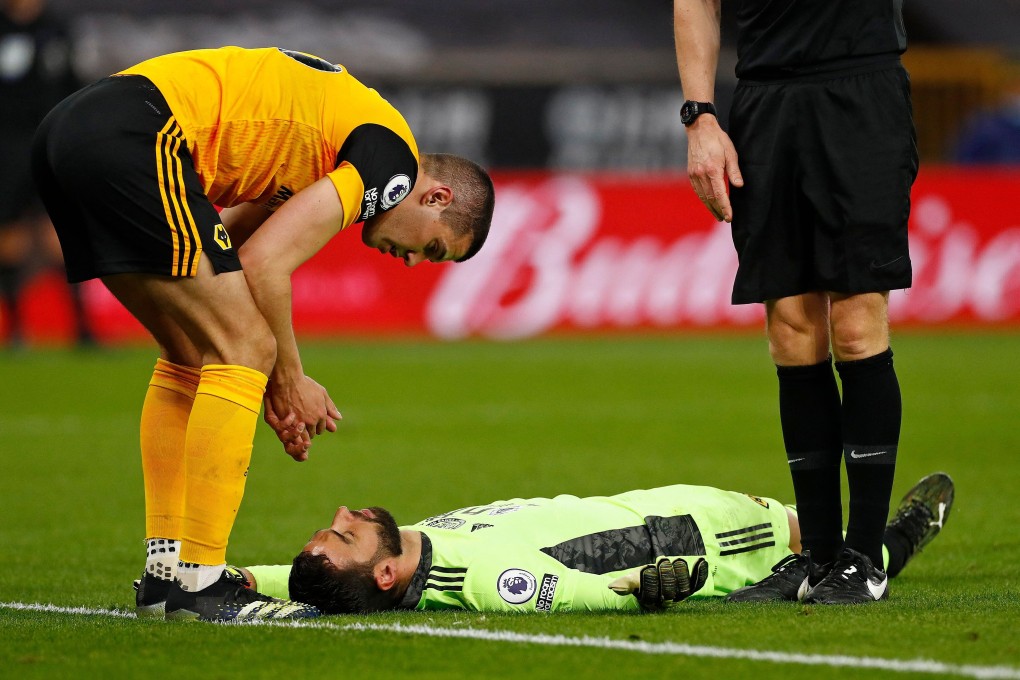 Wolverhampton Wanderers defender Conor Coady (left) talks to a stricken Rui Patricio after a clash between the two. Photo: AFP