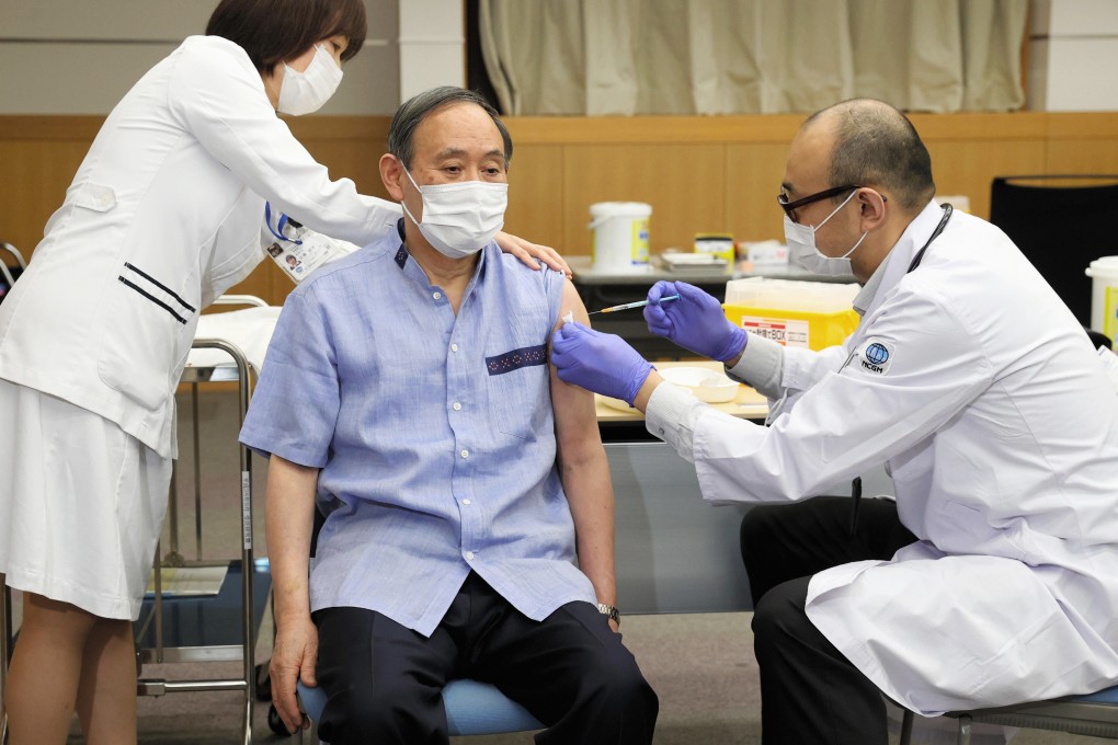 Japanese Prime Minister Yoshihide Suga receives the Pfizer Covid-19 vaccine at a hospital in Tokyo on Tuesday. Photo: Kyodo News via AP