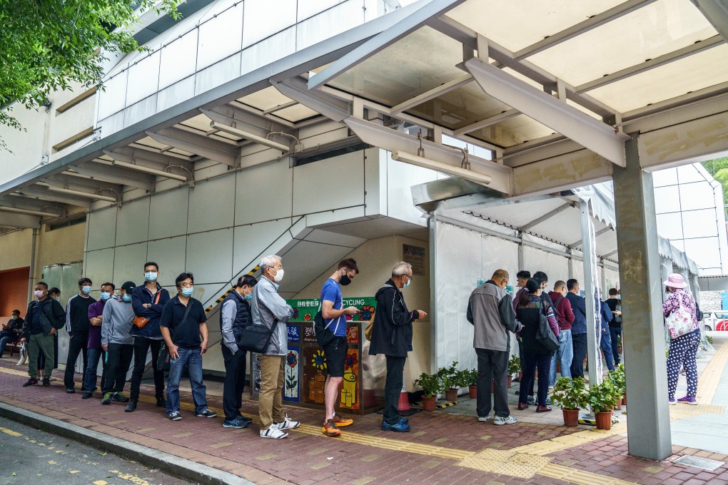 Hongkongers line up at a vaccination centre where the newly available BioNTech jab was being administered on Wednesday. Photo: Bloomberg