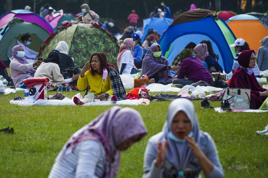 Domestic helpers enjoy their day off in Victoria Park in December. Photo: Sam Tsang