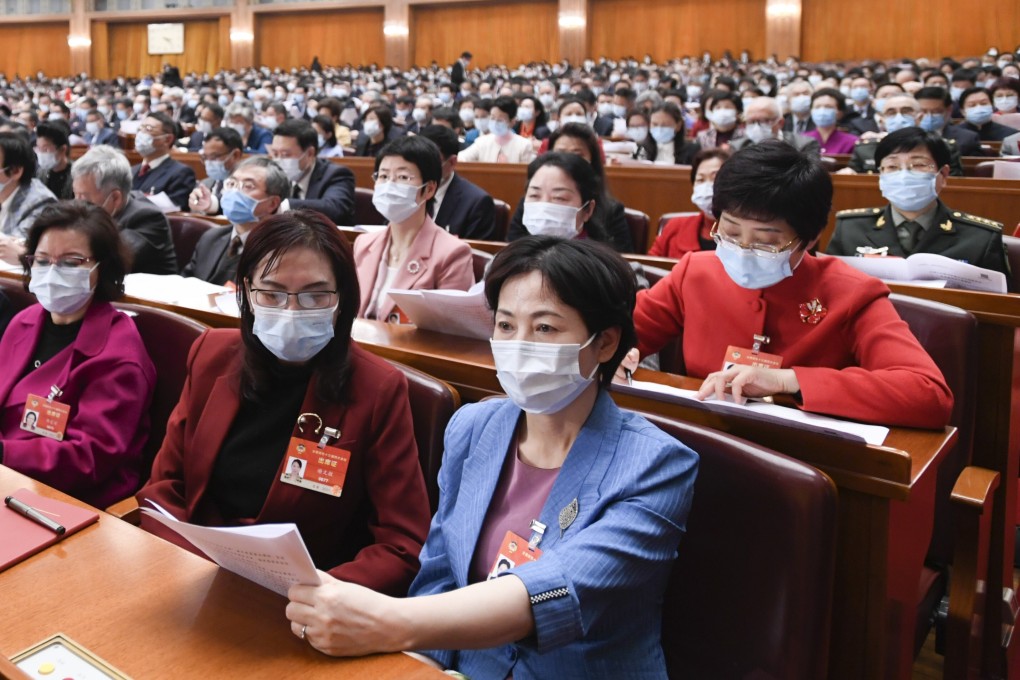 Women delegates attend the opening meeting of the CPPCC National Committee at the Great Hall of the People in Beijing. Photo: Xinhua