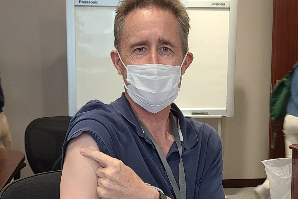 Colin Grant shows off his vaccination mark and Band-Aid. He is urging all of his Pure staff members to get vaccinated too. Photo: Patrick Blennerhassett