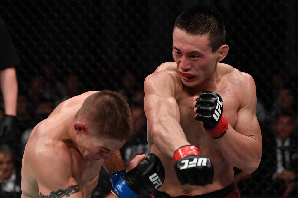 Song Kenan punches Derrick Krantz in their welterweight bout during the UFC Fight Night event at Shenzhen Universiade Sports Centre on August 31, 2019 in Shenzhen, China. Photo: Brandon Magnus/Zuffa LLC/Zuffa LLC