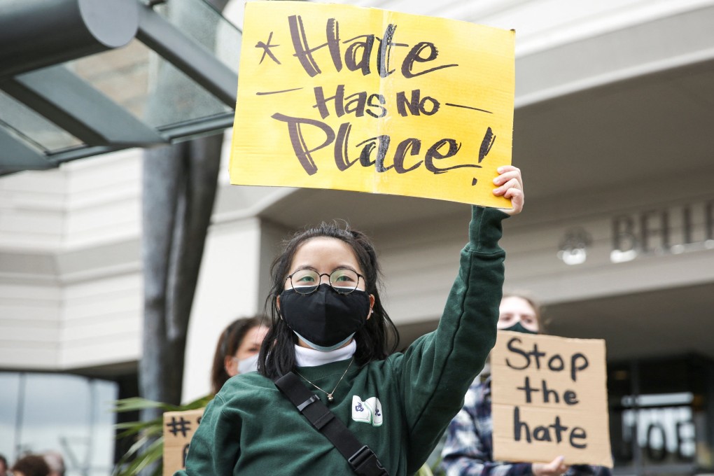 A protester holds a sign that reads “hate has no place” during the We Are Not Silent rally organised by the Asian-American Pacific Islander (AAPI) Coalition Against Hate and Bias in Bellevue, Washington, on Thursday. Photo: AFP