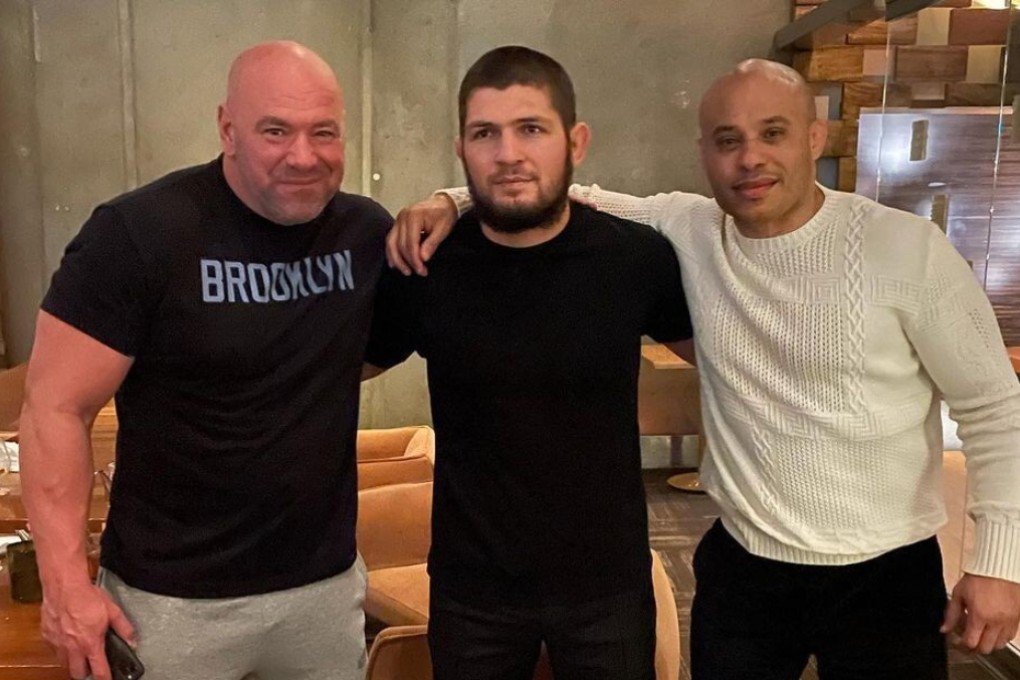 Khabib Nurmagomedov (centre) poses with Dana White (left) and his manager Ali Abdelaziz at dinner in Las Vegas.